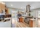 Contemporary kitchen showcases stainless steel appliances, stylish backsplash, and wood accents at 1055 Quartz St, Golden, CO 80401