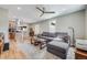 Open-concept living room, seamlessly connecting to a modern kitchen with a breakfast bar at 1055 Quartz St, Golden, CO 80401