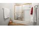 Bathroom featuring a bathtub and shower with a glass enclosure at 3407 S Ammons St # 20-1, Lakewood, CO 80227