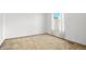 Bedroom with a large window and neutral carpet flooring at 3407 S Ammons St # 20-1, Lakewood, CO 80227