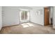 Bedroom featuring a large window, shelving, and carpeted flooring at 3407 S Ammons St # 20-1, Lakewood, CO 80227