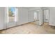 Bedroom featuring a window, carpet, and large mirror closet doors at 3407 S Ammons St # 20-1, Lakewood, CO 80227