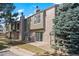 Inviting townhome with brick and siding, mature trees, and a private patio at 3407 S Ammons St # 20-1, Lakewood, CO 80227