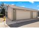 Exterior view of the garage with painted door at 3407 S Ammons St # 20-1, Lakewood, CO 80227