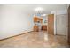 A full view of the kitchen with standard appliances and neutral tile flooring at 3407 S Ammons St # 20-1, Lakewood, CO 80227