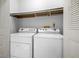 A conveniently located laundry room featuring a side-by-side washer and dryer at 3407 S Ammons St # 20-1, Lakewood, CO 80227