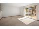Living room with lots of natural light and sliding glass doors to the outside at 3407 S Ammons St # 20-1, Lakewood, CO 80227