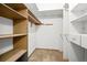 Walk-in closet with built in shelving and plenty of storage space at 3407 S Ammons St # 20-1, Lakewood, CO 80227