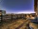 Backyard with fence, mountain views, grill, fire pit, and outdoor seating area on the patio at 9245 Star Streak Cir, Littleton, CO 80125