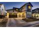 Charming two-story home with attached two-car garage and stone accents on the facade at 9245 Star Streak Cir, Littleton, CO 80125