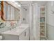 A sink and shower are featured in this bathroom alongside a nautical-themed design at 4539 E Caley Pl, Centennial, CO 80121