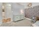 Comfortable bedroom featuring a decorative wall and a view of the backyard at 4539 E Caley Pl, Centennial, CO 80121