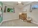 Bedroom with crib, a wicker chair, and plenty of natural light at 4539 E Caley Pl, Centennial, CO 80121
