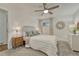 Carpeted bedroom features an upholstered headboard and coordinated side tables and lamps at 4539 E Caley Pl, Centennial, CO 80121