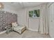 Cozy bedroom with a charming decorative wall and a rocking chair at 4539 E Caley Pl, Centennial, CO 80121