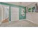 Bright bedroom featuring a large closet, neutral carpet, and an accent green wall at 4539 E Caley Pl, Centennial, CO 80121