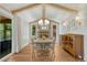 Charming dining room with exposed beams, brick fireplace, and ample natural light at 4539 E Caley Pl, Centennial, CO 80121