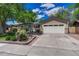 Charming single-story home with a large front yard, attached garage, and appealing curb appeal at 4539 E Caley Pl, Centennial, CO 80121