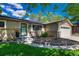 Close up view of a home with a front entry framed by brick and complemented by tasteful landscaping at 4539 E Caley Pl, Centennial, CO 80121