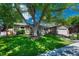 A charming one-story home surrounded by mature trees and lush greenery, offering a serene setting at 4539 E Caley Pl, Centennial, CO 80121