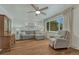 Bright living room featuring hardwood floors, neutral walls, and comfortable seating area with natural light at 4539 E Caley Pl, Centennial, CO 80121