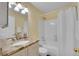 Well-lit bathroom featuring a double vanity, granite countertop, and a shower-tub combination with white tile at 1308 S Danube Way # 102, Aurora, CO 80017