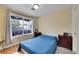 Comfortable bedroom with hardwood floors, large window, and a neutral color scheme with ample natural light at 1308 S Danube Way # 102, Aurora, CO 80017