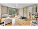 Inviting bedroom with hardwood floors, two twin beds, large window, and a playful climbing frame for  at 1308 S Danube Way # 102, Aurora, CO 80017