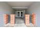 Gated entrance featuring brick pillars and access to multiple units at 1308 S Danube Way # 102, Aurora, CO 80017
