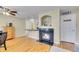Warm living room featuring a fireplace and hardwood floors, adjacent to the kitchen at 1308 S Danube Way # 102, Aurora, CO 80017