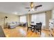 Sunlit living room with hardwood floors, neutral walls, and comfortable seating area at 1308 S Danube Way # 102, Aurora, CO 80017