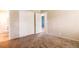A basic bedroom featuring a closet and access to the bathroom at 1060 Saulsbury St, Lakewood, CO 80214