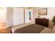 Staged bedroom featuring a closet and wood dresser for storage at 1060 Saulsbury St, Lakewood, CO 80214
