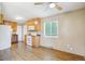 Open eat-in kitchen with wooden cabinets and white appliances at 1060 Saulsbury St, Lakewood, CO 80214