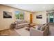 Well-lit, staged living room with contemporary furniture and decor at 1060 Saulsbury St, Lakewood, CO 80214