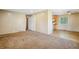 View of the open living room space with access to the kitchen at 1060 Saulsbury St, Lakewood, CO 80214