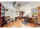 Finished basement includes a variety of furniture and a shelving unit with art and decorations at 1008 Yeager Dr, Longmont, CO 80501