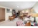 Finished basement with a seating area, workspace, brick fireplace and an adjacent entrance at 1008 Yeager Dr, Longmont, CO 80501