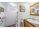 Bathroom featuring a shower, pedestal sink, framed mirror and modern lighting at 1008 Yeager Dr, Longmont, CO 80501