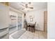 Bright breakfast nook area with a sliding glass door to the exterior and a ceiling fan at 1008 Yeager Dr, Longmont, CO 80501