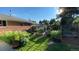Backyard features a garden with raised beds, trellises, a variety of flowers, plants, and lush green grass at 1008 Yeager Dr, Longmont, CO 80501