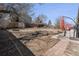 Spacious backyard featuring mature trees, patio area, and privacy fence, perfect for outdoor enjoyment at 3953 S Richfield St, Aurora, CO 80013