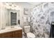 Bathroom featuring a vanity with a sink, a toilet, and a shower with an Eiffel Tower-themed curtain at 3953 S Richfield St, Aurora, CO 80013