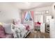 Bedroom featuring a Hello Kitty theme, with a bed, a desk, and a vanity at 3953 S Richfield St, Aurora, CO 80013