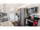 Modern kitchen featuring stainless steel appliances, granite countertops, and sleek cabinetry at 3953 S Richfield St, Aurora, CO 80013