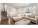 Comfortable sectional sofa and ottoman, stairs, and view through window at 3953 S Richfield St, Aurora, CO 80013