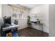Home office featuring a desk, a chair, and a window overlooking the backyard at 3953 S Richfield St, Aurora, CO 80013