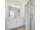 Elegant bathroom with a large vanity, quartz countertop, and a glass-enclosed shower at 1257 Rhett Dr, Erie, CO 80026