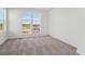 Spacious bedroom bathed in natural light from two large windows at 1257 Rhett Dr, Erie, CO 80026