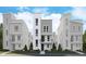 Contemporary townhome with multi-textured facade, balcony, and landscaped front yard at 1257 Rhett Dr, Erie, CO 80026